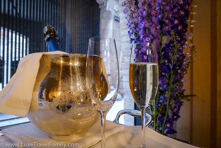 A bottle of cava and two glasses in the reception at the Mercer Hotel Barcelona.