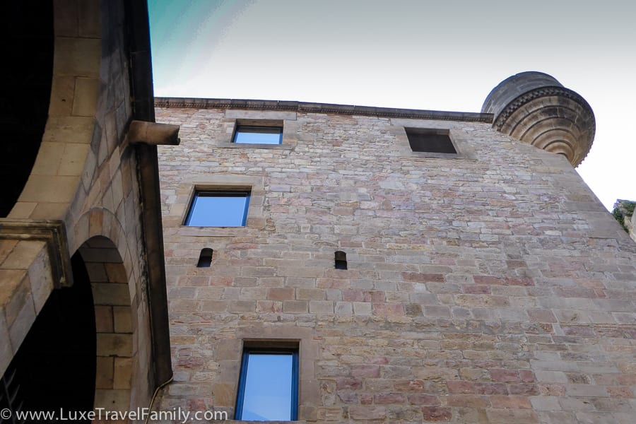 A stone wall and circular turret on Palau del Lloctinent, Barcelona