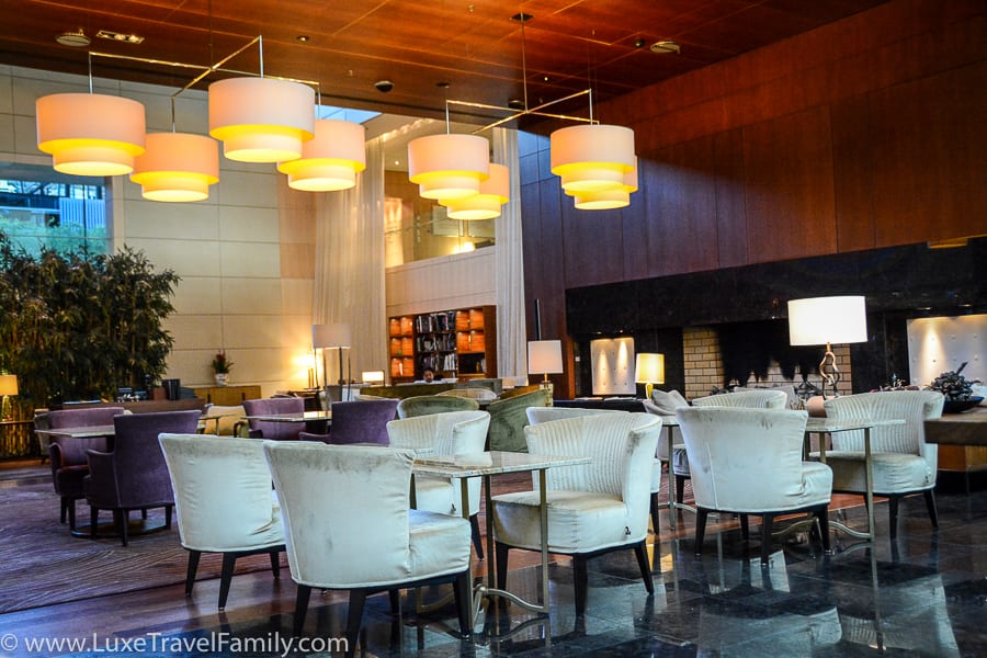 Park Hyatt Zurich Lobby Lounge chairs, tables and large fireplace
