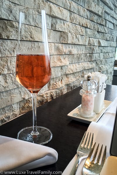 A glass of rose champagne in the Swiss First Class Lounge