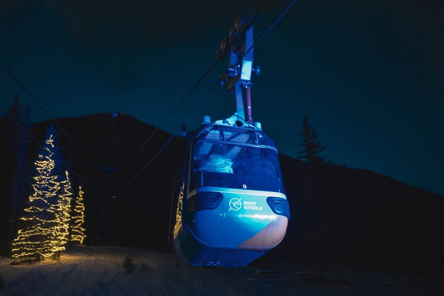 Nightrise Banff Gondola suspended in dark sky