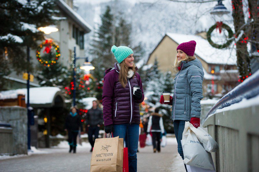Two women shopping in Whistler Village in winter