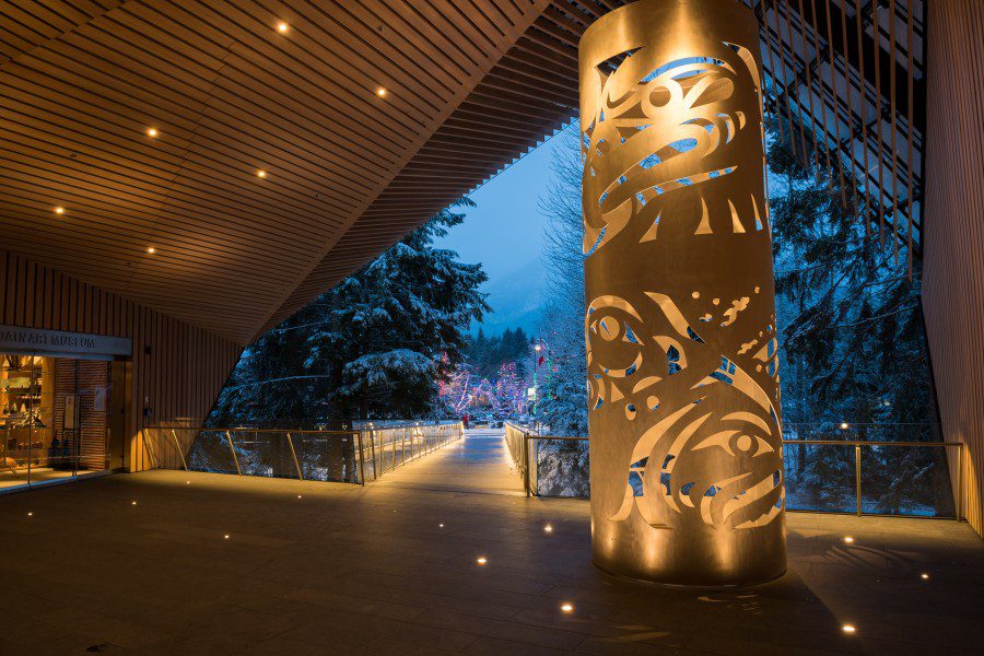 Outdoor entrance space Audain Art Museum Whistler with metal Indigenous carving