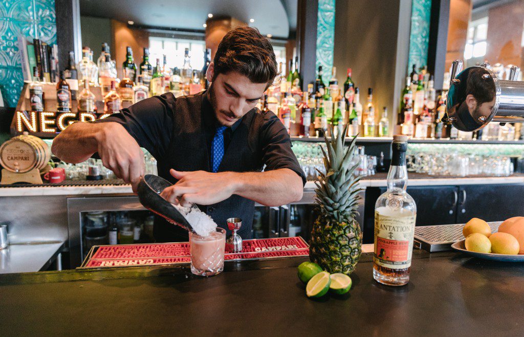 Bartender making a cocktail at the Raven Room Lounge Pan Pacific Whistler