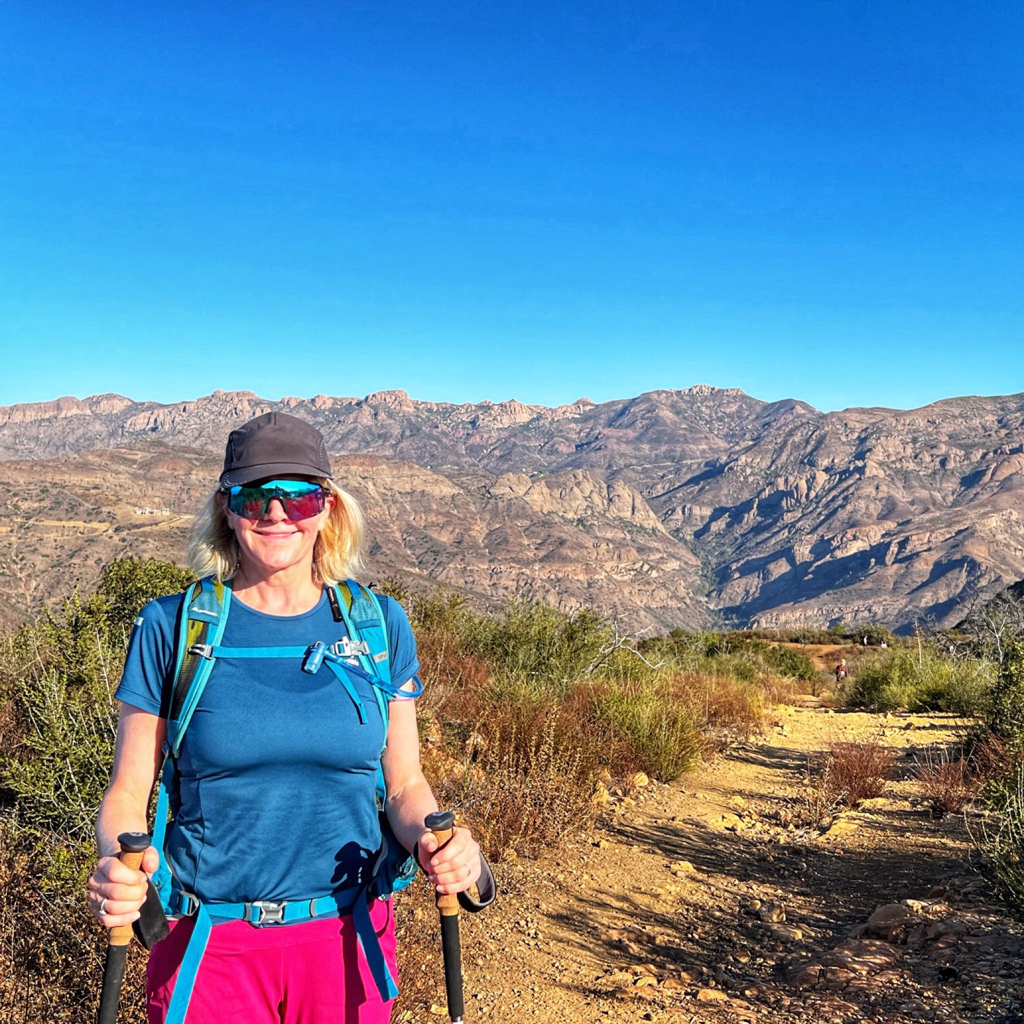 Woman pink shorts and blue shirt what to wear The Ranch Malibu
